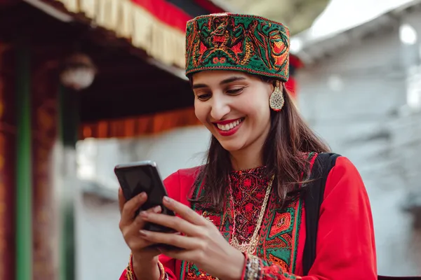 A person using their device against a moody casino-themed background, illustrating the smooth re-entry process at BK33.